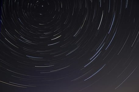 Star trails representing systemic cycles and continuous organizational evolution