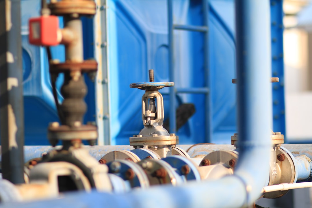 Close-up of industrial pipes and valves in a factory setting
