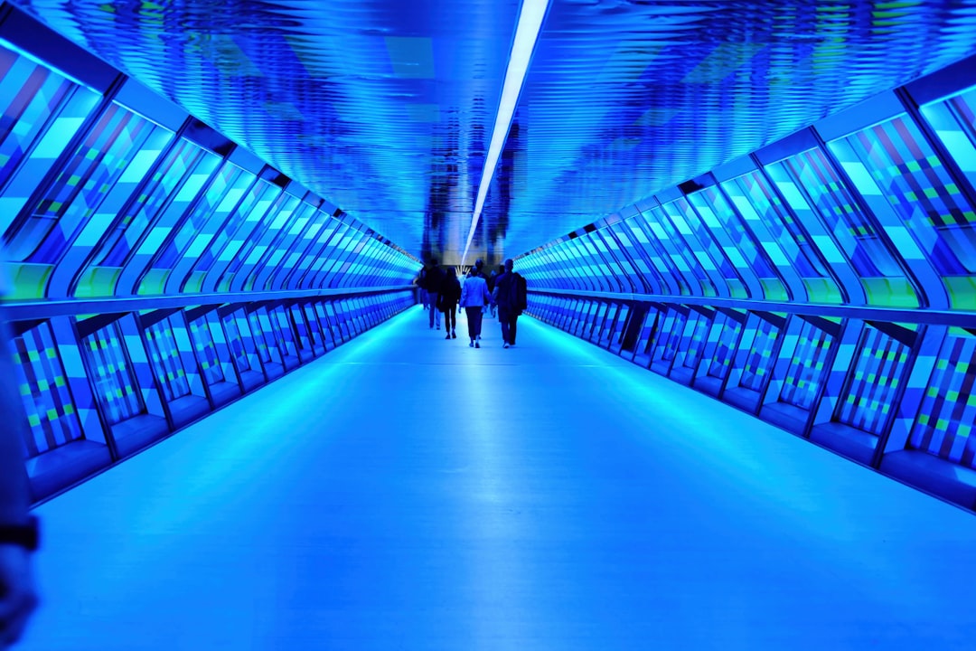 Futuristic blue-lit walkway symbolizing the bridge between edge and centralized computing