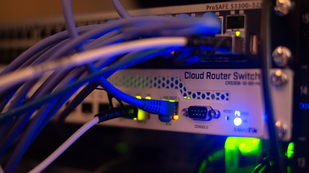 Close-up of network infrastructure with ethernet cables connected to switching equipment