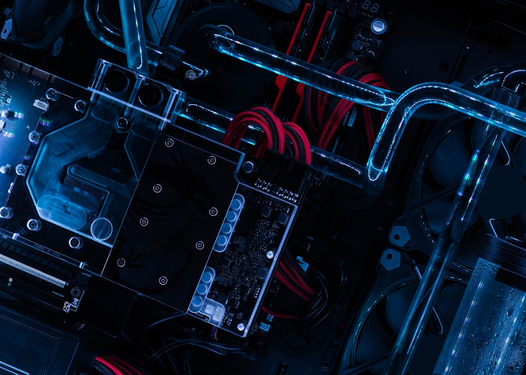 Close-up of a dark circuit board with intricate electronic pathways
