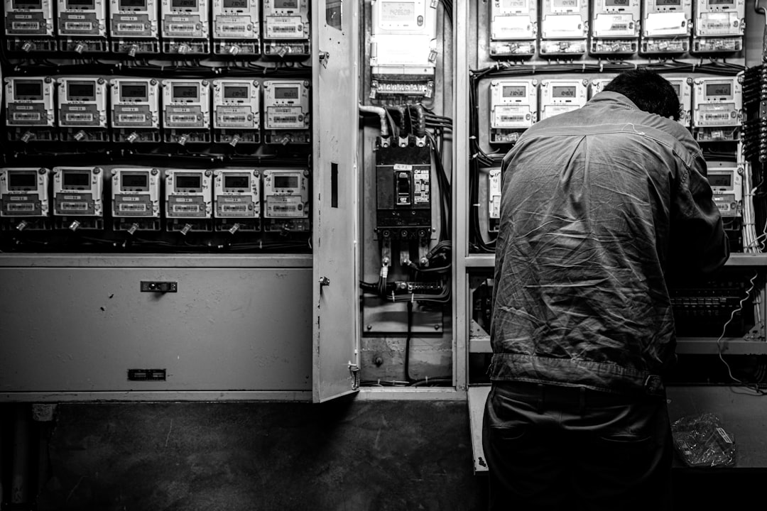 Engineer standing in front of a large server infrastructure