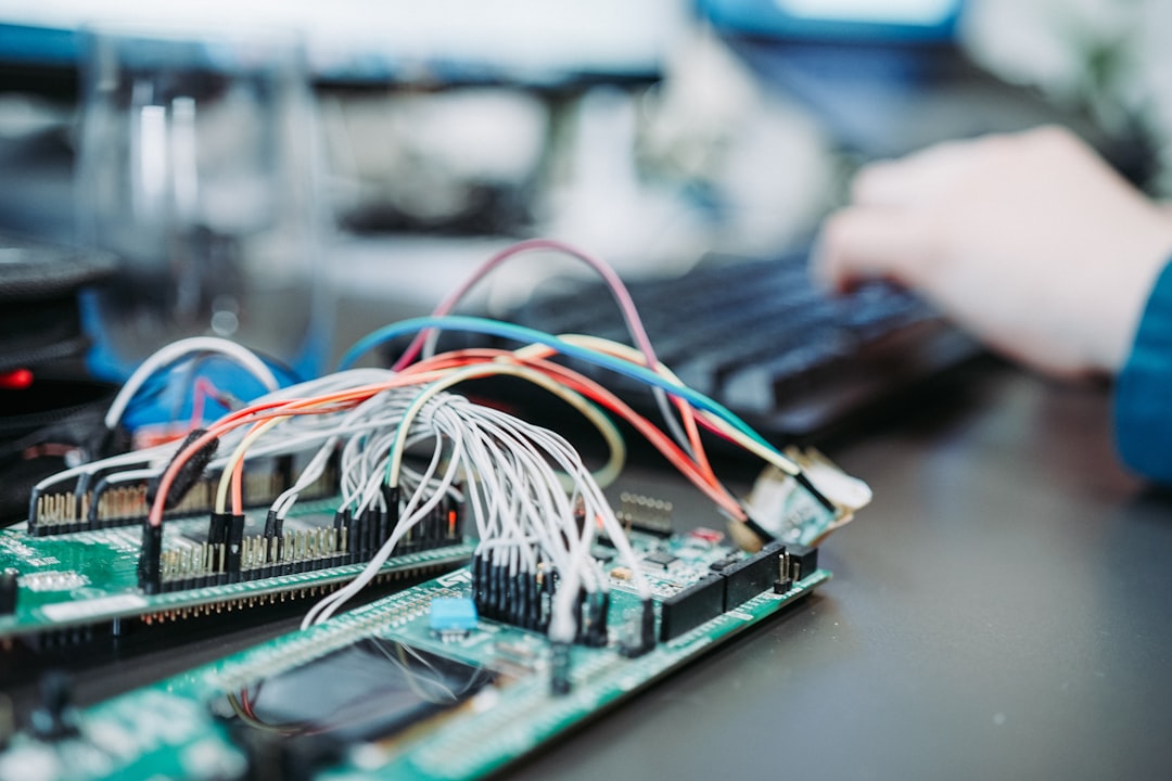 Engineer working with circuit board representing hands-on infrastructure testing