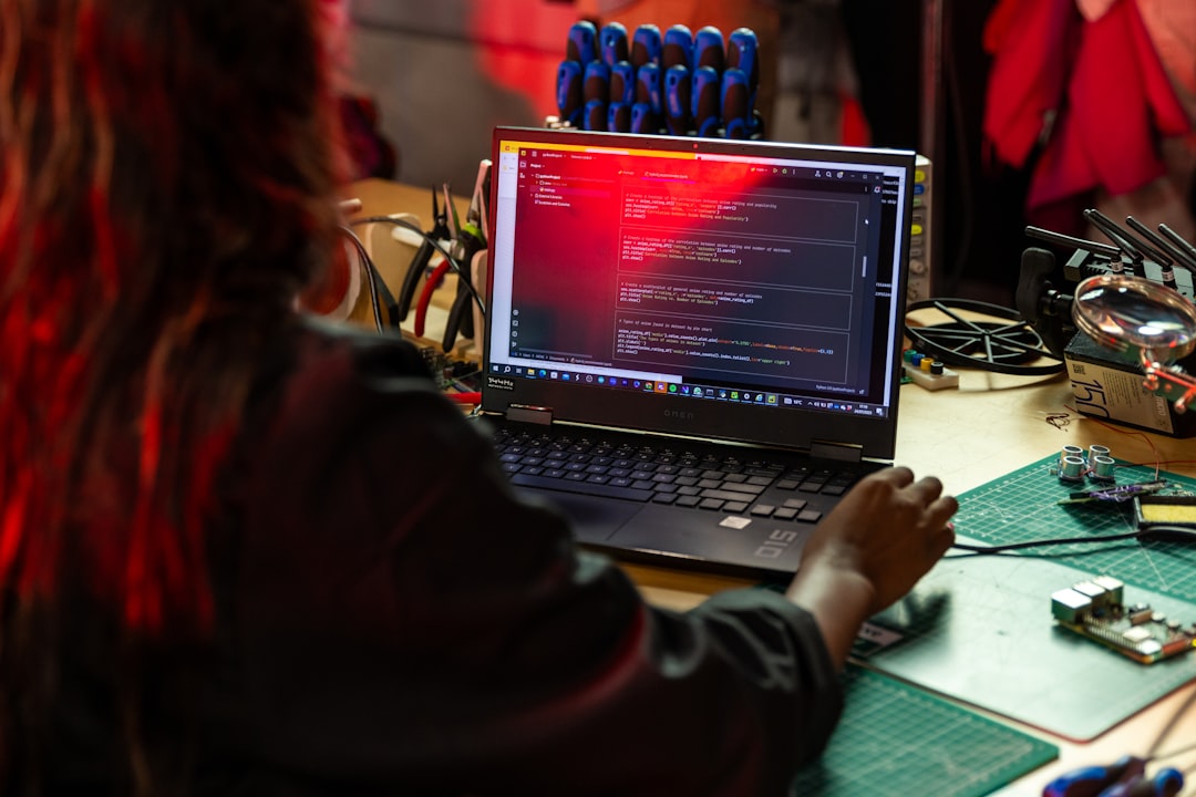 Engineer working at a computer terminal representing the integration of compliance automation into AI development workflows