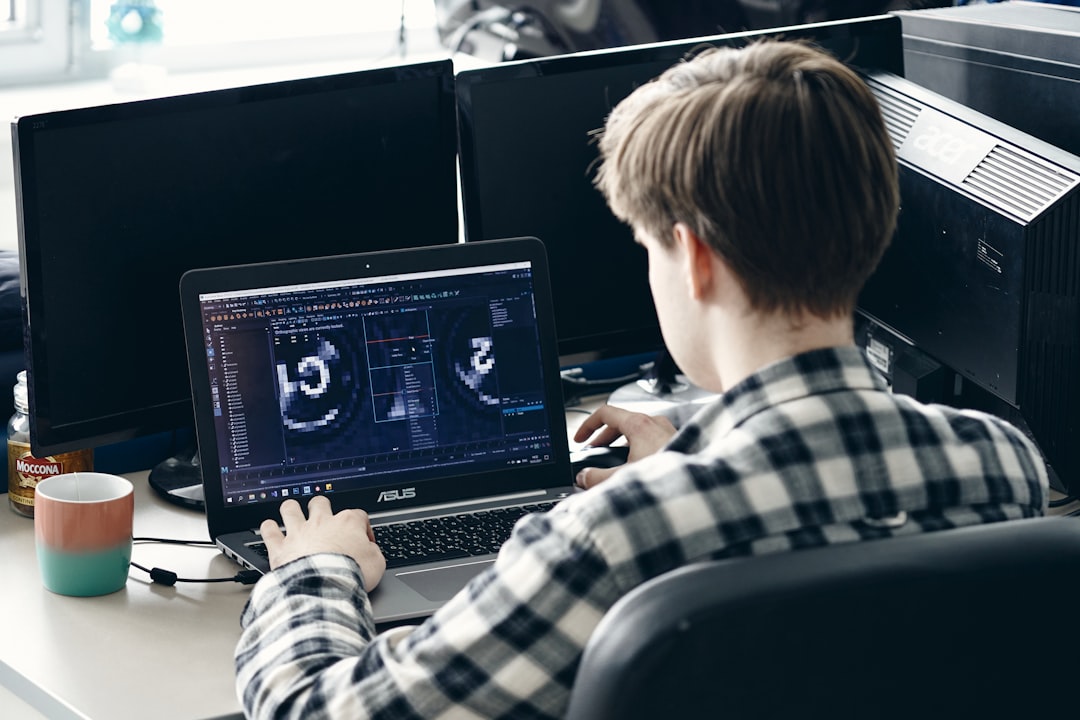 A professional working with technology representing the intersection of regulation and AI