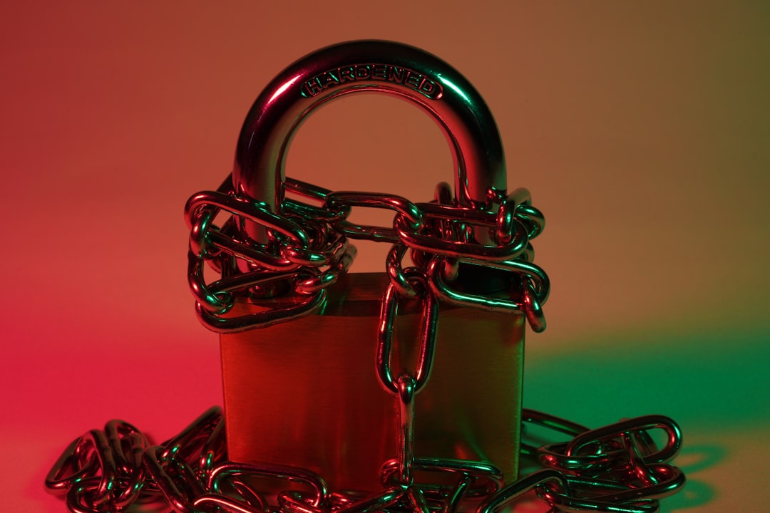 A red padlock on a metal chain symbolizing digital security
