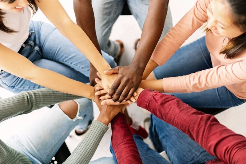 Team hands stacked together